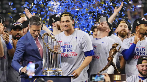Texas Rangers shortstop Corey Seager (5) celebrates with the World Series MVP after the Texas Rangers beat the Arizona Diamondbacks to win the World Series in game five of the 2023 World Series at Chase Field in Phoenix on Nov. 1, 2023.  